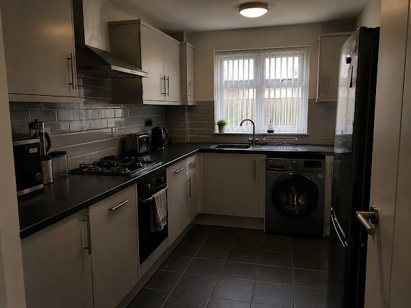 Sparkling grey kitchen with polished benchtops and appliances